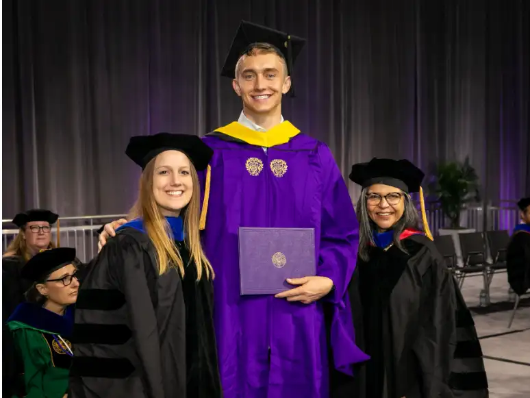 Palmer smiling at his Northwestern University graduation, symbolizing how perseverance and support can help parents raise resilient kids.